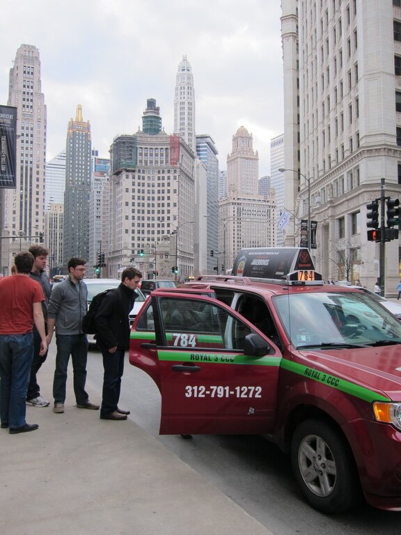 People getting inside a taxi near Magnificent Mile Chicago