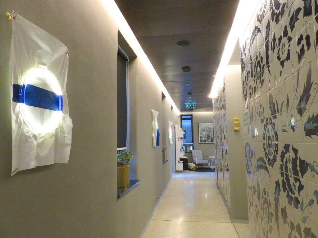 Corridor in Bezalel Hotel with lighting decorated with Israeli colors