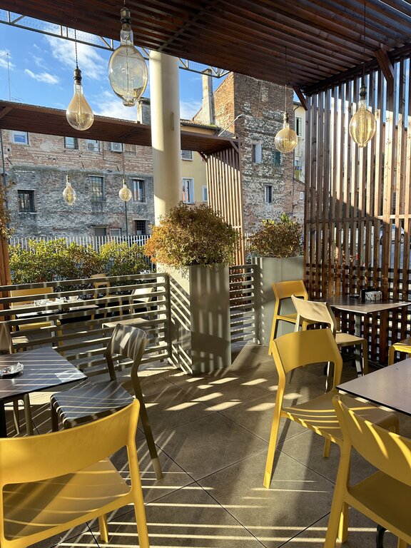 Tables and chairs outside Declaire, Vicenza Italy