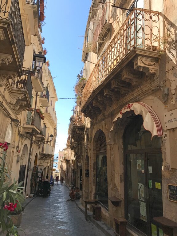 Shop-lined street in Ortigia Syracuse Sicily