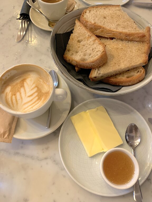 Simple breakfast of homemade bread, honey and butter at EK Bistro in Ljubljana, Slovenia