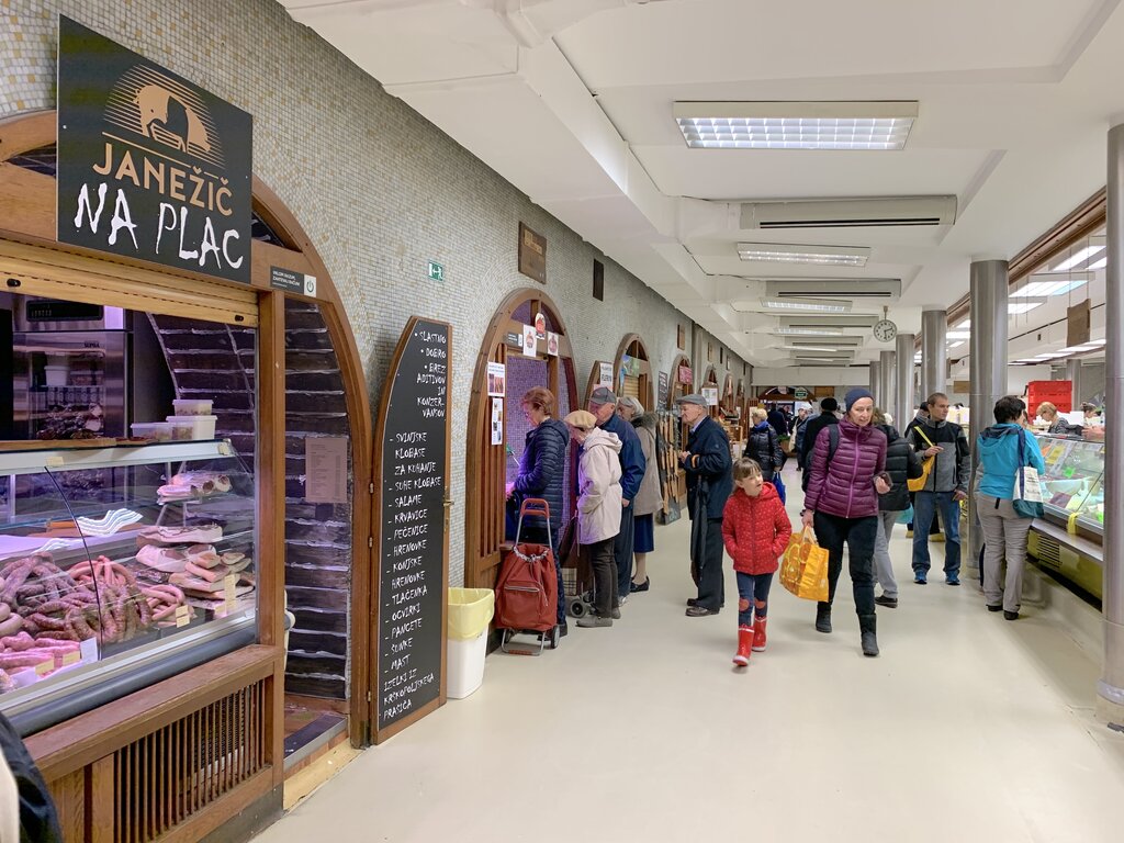 People walking inside the central market in Ljubljana, Slovenia