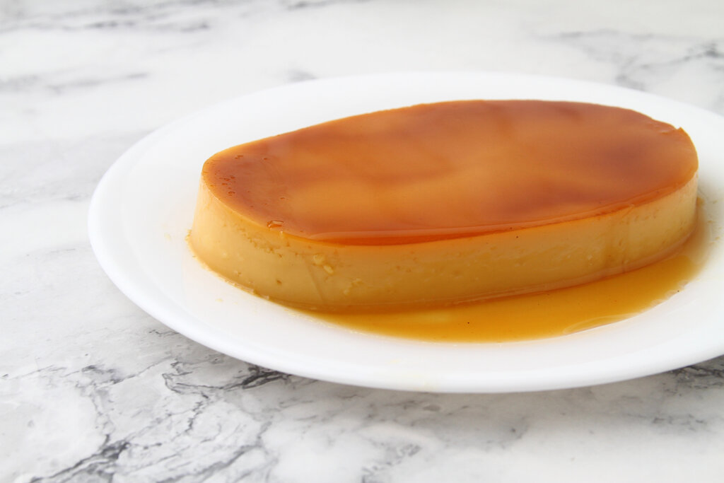 Leche flan on a white plate