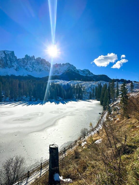 A frozen Lake Carezza in winter - best Christmas cities in Europe