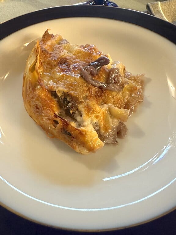 Pasticcio with radicchio on a plate