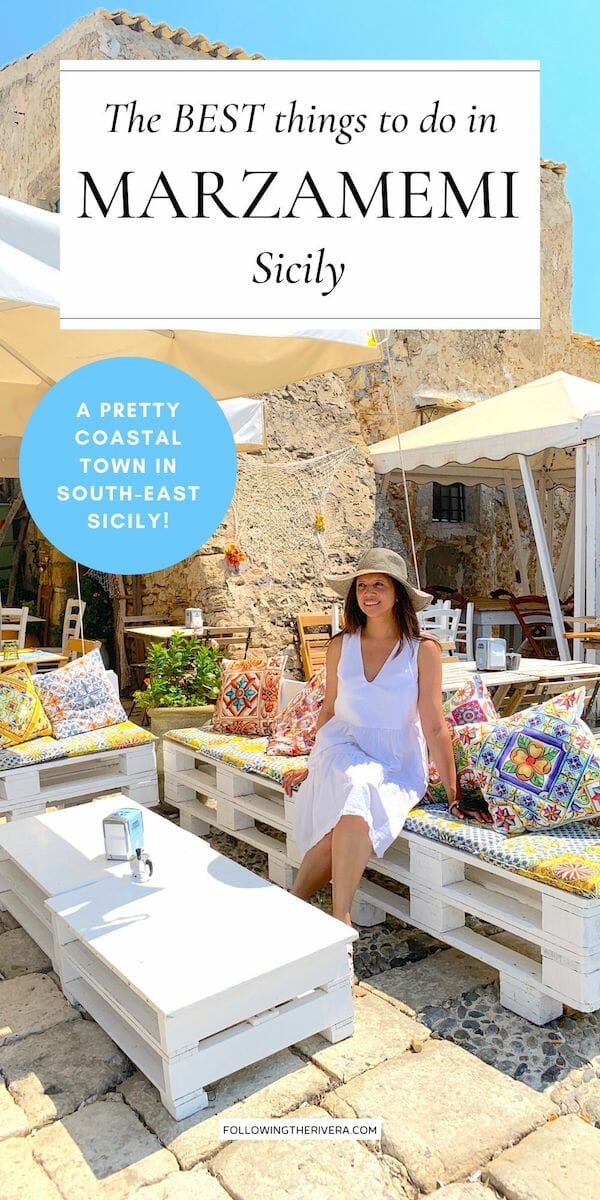 Lisa Rivera sitting on a bench in Marzamemi Sicily