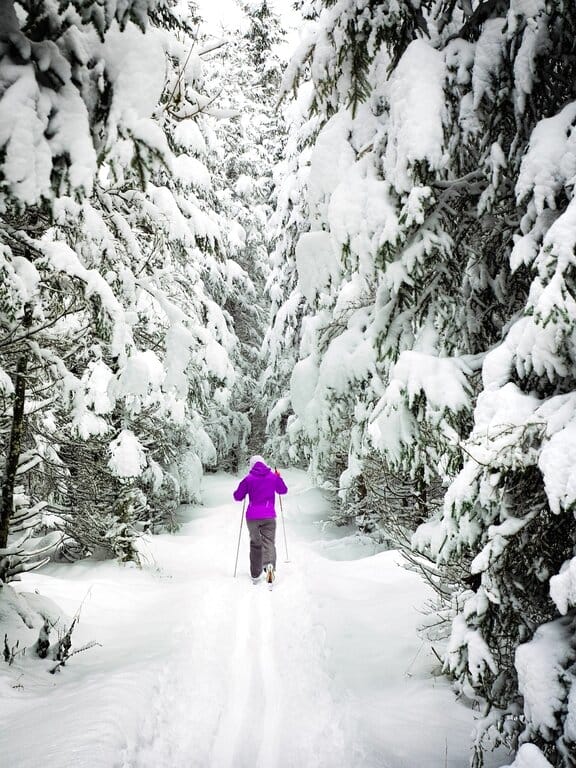 A woman cross country skiing - US all inclusive ski resorts