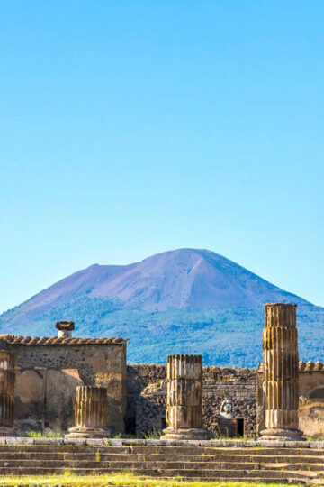 View of Pompeii and Mount Vesuvius in background - how to get from Rome to Pompeii ©bloodua/Depositphotos
