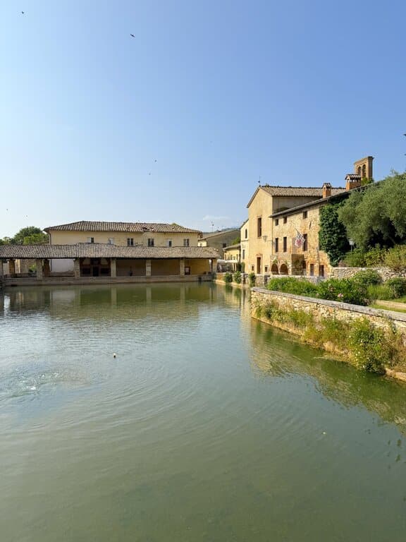 The ancient stone thermal spring in the Piazza delle Sorgenti, the unique main square of Bagno Vignoni in Tuscany, Italy
