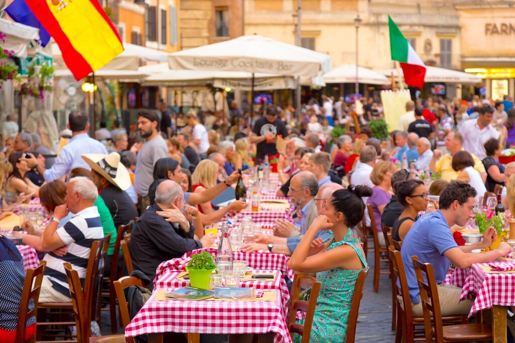 People dining outdoors in Piazza de Fiori Rome Italy - free movie locations in Italy