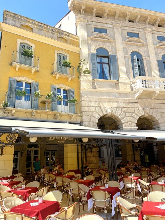 People dining outdoors in a restaurant in Piazza Brà in Verona Italy. Taken by Lisa Rivera