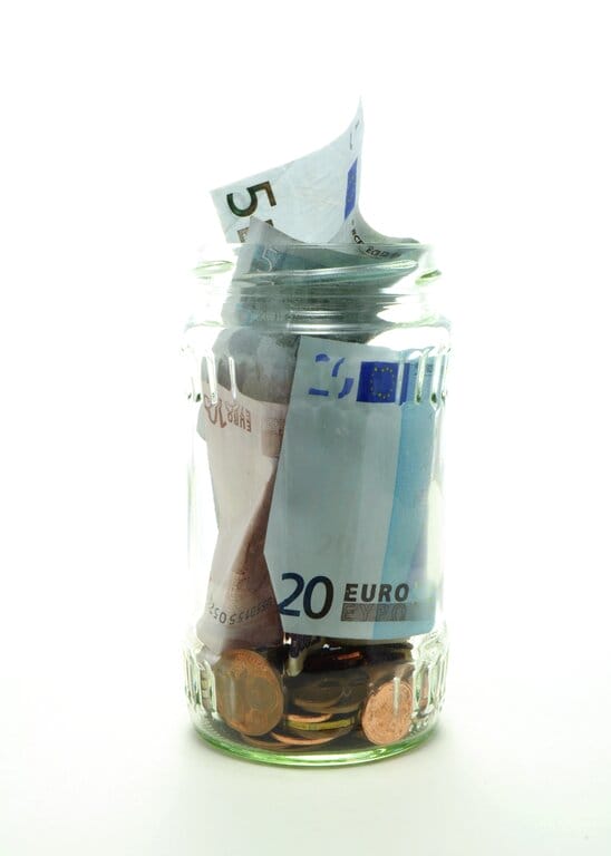 Tip jar with Euros and coins inside