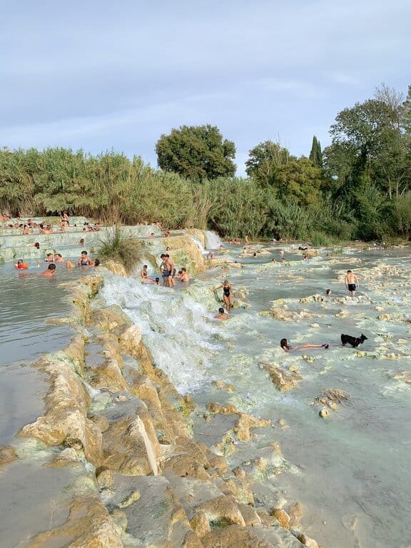 People bathing in Saturnia thermal baths