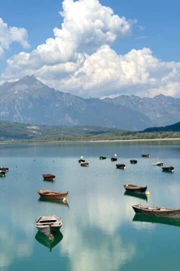 Boats on the water at Lago di Santa Croce Italy in October