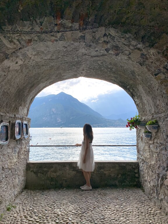 Lisa Rivera standing by a viewpoint in Varenna Lake Como