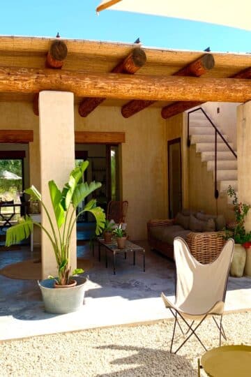 Outdoor table and chairs in clubhouse in IUTA Glamping & Farm, Sicily in September in Italy