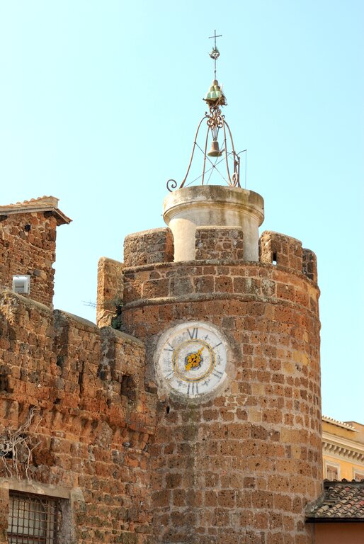 The clock tower and medieval walls in Cerveteri Lazio Italy sonia62 Depositphoto