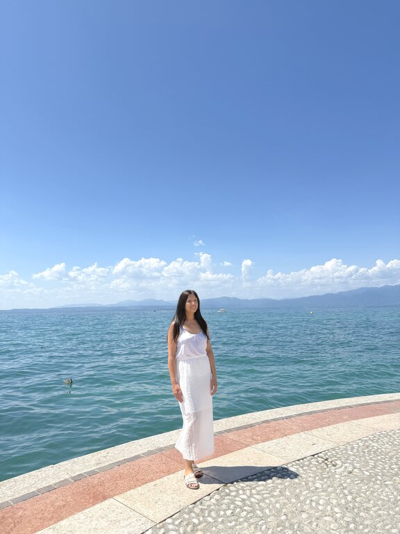 Lisa Rivera standing in Lazise Lake Garda