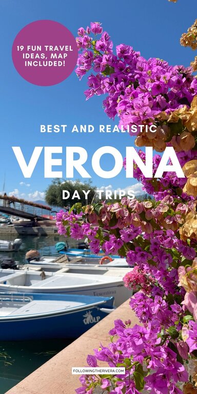 Pink flowers and boats on the water in Bardolino Lake Garda Italy