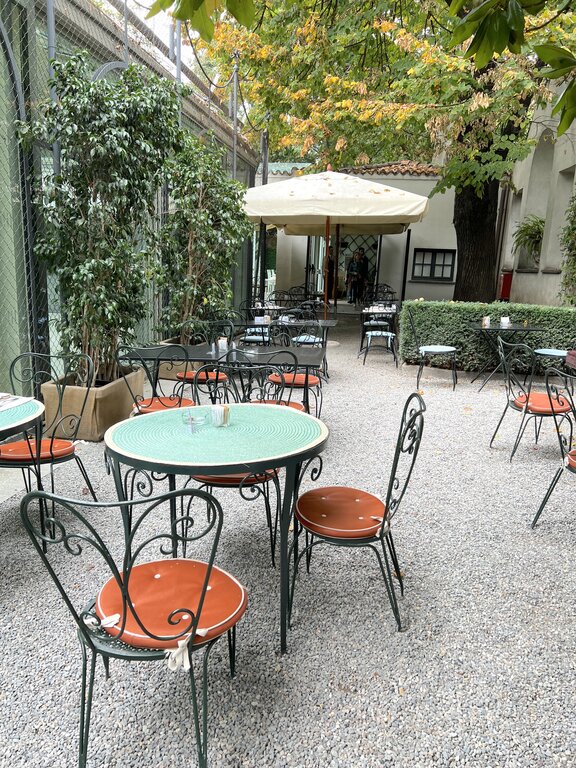Tables and chairs at the cafe at Villa Necchi Campiglio in Milan Italy
