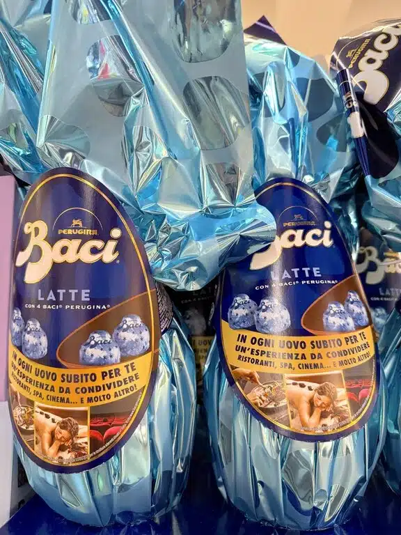 Two Baci Perugina chocolate Easter eggs in decorative spring wrap, a popular gift for Italian children and adults on Pasqua